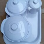 White unbreakable bowls, cup with cover and tray